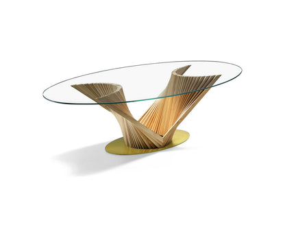 Natisa By Reverse dining table with oval glass top and sculpted ash wood strip base on a white background