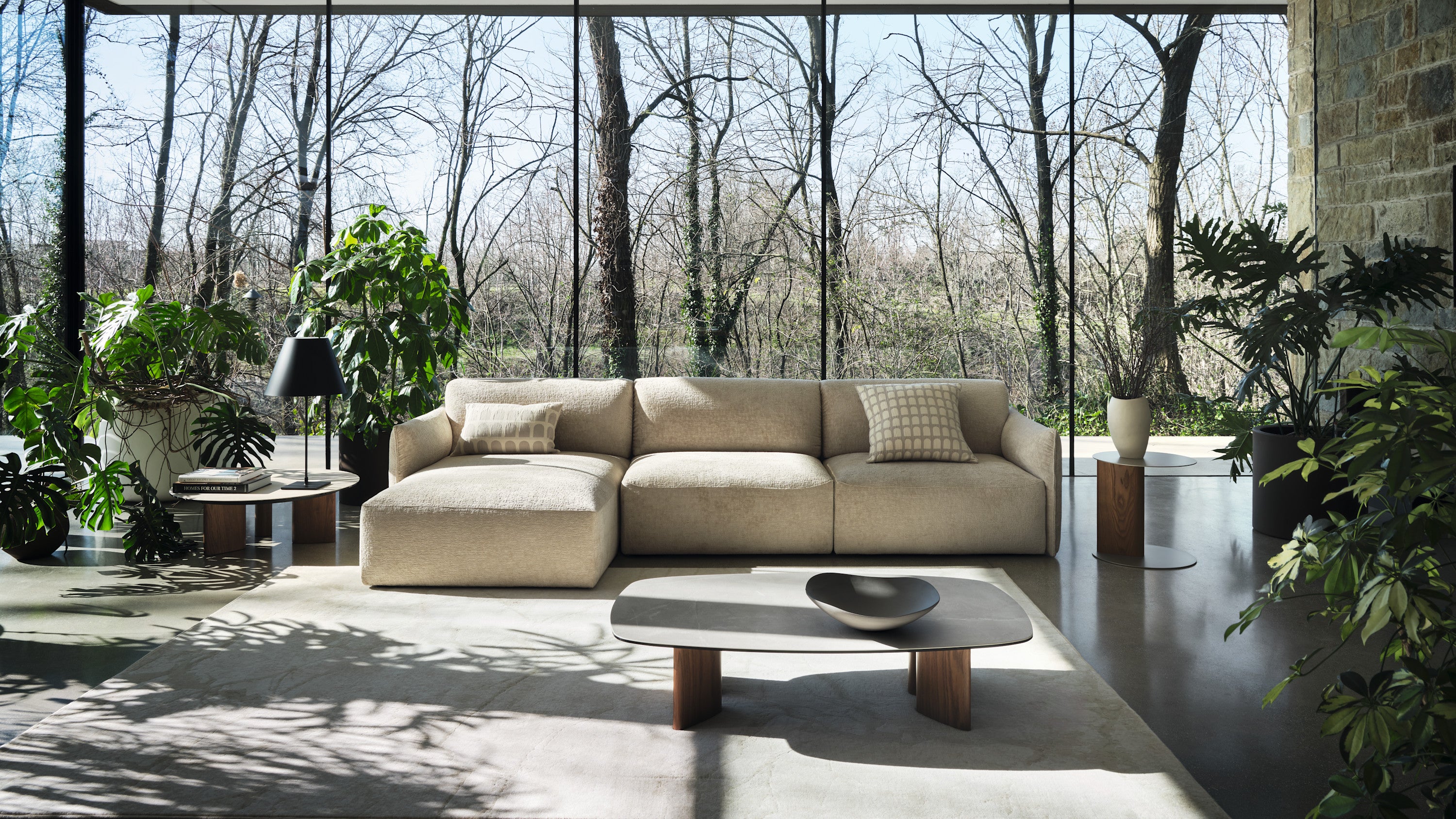 Cave rug by Calligaris in a living room with a sectional sofa and a coffee table