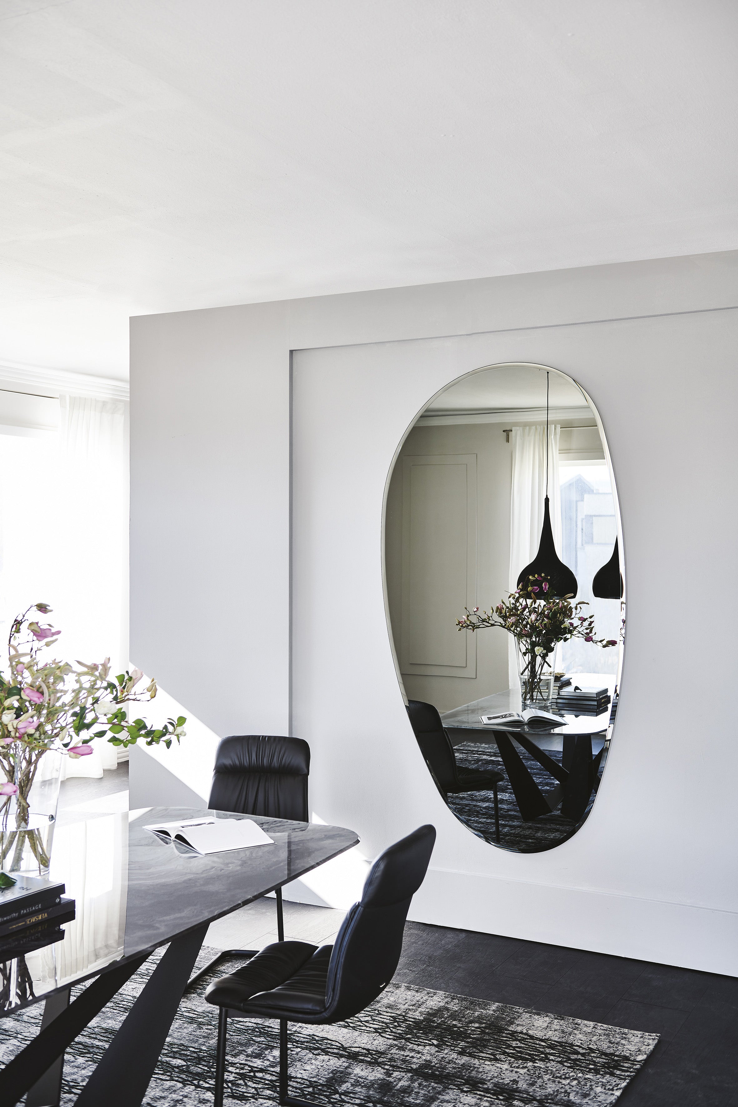 Hawaii Magnum mirror on a white wall in a dining room, full view