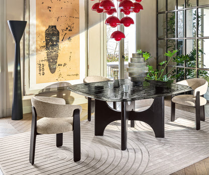 Mirage rug by Calligaris in Ecru/Beige under a dining table with upholstered armchairs