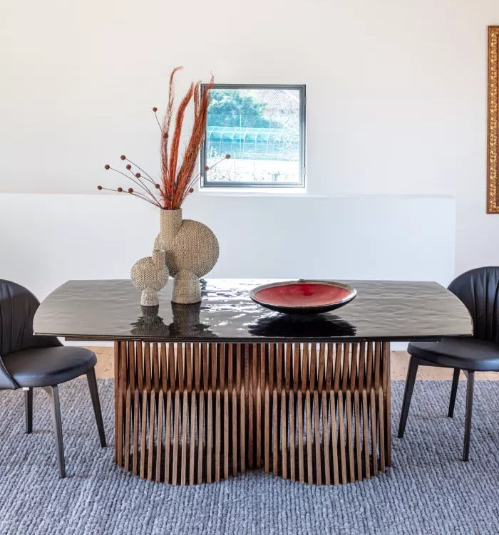 Nest A Double dining table by Natisa with glass top and ash wood strip base, styled with chairs and vases